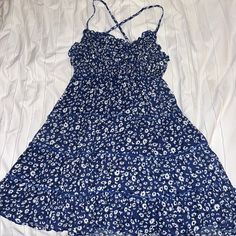 Blue Floral Dress. From Shein. Size Small, Never Worn. Zips In Back, Straps Cross In The Back, And Are Adjustable (Stretchy Material) Blue Floral Print Sleeveless Sundress, Blue Floral Print Mini Dress With Spaghetti Straps, Blue Floral Mini Dress With Spaghetti Straps, Blue Flowy Sundress With Spaghetti Straps, Blue Flowy Sundress For Daytime, Blue V-neck Sundress For Daytime, Blue Spaghetti Strap Sundress For Daytime, Blue Spaghetti Strap Dress For Daytime, Blue Sundress For Daytime