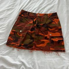 Urban Outfitters Camo Cargo Skirt Size Medium Condition: Nwot Color: Orange Details : - Cargo - Raw Cut Hem Extras: - I Ship Between 1-2 Days Orange Skirt Bottoms With Pockets, Fall Mini Cargo Skirt Lined, Fall Cotton Mini Cargo Skirt, Casual Camouflage Cargo Skirt With Pockets, Camouflage Mini Cargo Skirt For Summer, Camo Cargo Skirt, Casual Orange Mini Skort, Urban Outfitters Mini Skirt With Pockets For Summer, Orange Casual Mini Skort