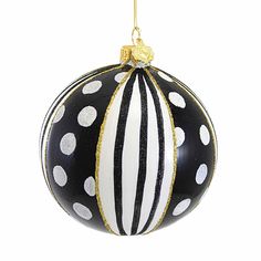 a black and white ball ornament with gold trimmings on the top