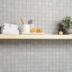 a shelf with towels and other items on it