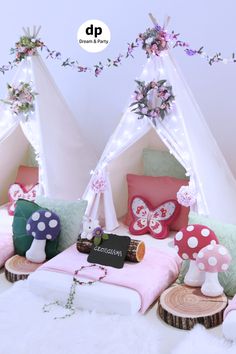 a group of teepees sitting next to each other on top of a bed