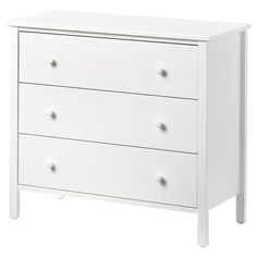 a white dresser with three drawers and four knobs on the bottom drawer, against a white background