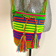 Wuitusu Wayuu Madelyn Small Size Mochila This Small-Sized Wayuu Bag Has A Traditional Base, Closed By Strings. You Can Fit A Lot In, And It Is Very Secure. The Bag Measures 5 Inches Long, And 8 Inches Wide. The Straps Adds Other 19 In. New Without Tags Multicolor School Bag For Spring, Multicolor Bucket Shoulder Bag For School, Multicolor School Bag For Summer, Multicolor Summer School Bag, Yellow Woven Shoulder Bag For Travel, Spring Yellow Crochet Bag For Travel, Yellow Satchel Bucket Bag For Summer, Yellow Backpack For Everyday Summer Use, Yellow Summer Backpack For Everyday Use