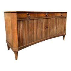 an old wooden cabinet with three drawers and two pulls on the front, against a white background