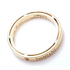 Authentic Damiani Brad Pitt 18k Yellow Gold Diamond 3mm Band Ring Sz 7.5  Retail Price: $2,850 Damiani Box + Paperwork included  Metal: 18k Yellow Gold  Measurements:  Weight: 4.2 grams  Width: 3mm  Size: 7.5 Resize  Available Stones: Round brilliant cut diamond total weight approx .05ct VS1 clarity, G color  Hallmarks: Damiani co-designed Damiani and Brad Pitt 750 Made in Italy Ti196hao  Dimensions reference the ring size and are not specific to the ring itself. Luxury Engraved Round Promise Ring, Luxury White Gold Rings With Hallmarks, Designer Yellow Gold Diamond Ring For Anniversary, Luxury Gold Stackable Rings With Brilliant Cut, Luxury Engraved Ring With Brilliant Cut As Gift, Luxury Engraved Ring With Brilliant Cut For Gift, Luxury Engraved White Gold Diamond Ring, Luxury Engraved Promise Ring, Designer Yellow Gold Diamond Ring Hallmarked