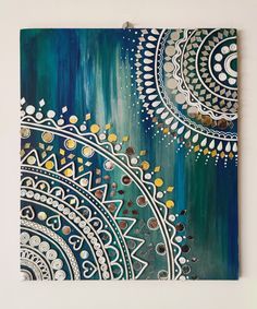 an abstract painting with blue and gold colors on it's canvas, hanging on a wall