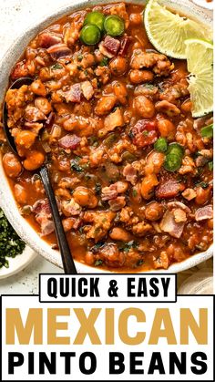 a bowl of mexican pinto beans with limes and cilantro