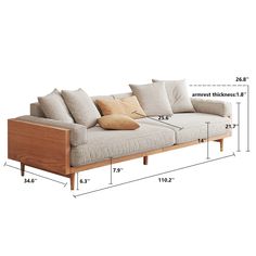 a couch with pillows and measurements for it