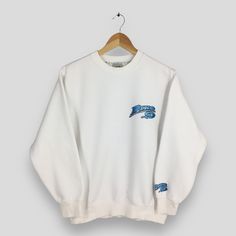 Vintage 90's Piko Surf White Sweatshirt Medium Piko Hawaiian Longboard Wear Sweater Piko Surfer Beach Pullover Piko Surfboard Jumper Size M Size On Tag :- Size M Manual Measurement :- WIDTH (armpit to armpit) :- 20" inches LENGTH (shoulder to end of garment) :- 25" inches WEIGH :- 0.41 kg Condition :- Good Condition. No holes and no stains. - Colors Might Be Different Due To Lighting. - All items are VINTAGE which show some signs of wear and tear. FEDEX EXPRESS = 3-6 business day arrived Please White Crew Neck Sweater In 90s Style, 90s Style White Crew Neck Sweater, White Long Sleeve Throwback Sweatshirt, White Cotton 90s Style Sweater, 90s Style White Cotton Sweater, White Crew Neck 90s Sweatshirt, White 90s Crew Sweatshirt, White 90s Crew Neck Sweatshirt, 90s White Crew Sweatshirt