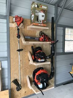 tools are stored on shelves in a garage