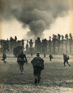 Infantry moved through open field.  Smoke far could be a down plane or a hit depot. Military History, Historical Photos, Soldier, Germany