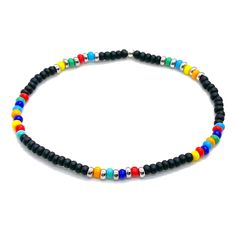 Perfect for Guys who Crave Beach Vibes Year Round Sea glass center bead; glass seed beads; silver-tone glass seed bead disks; finished with a sterling silver bead. Stretch style. Waterproof. Perfect solo or stacked. Handmade in NYC. Multicolor Beaded Bracelets With Black Beads For Beach, Black Heishi Beads For Beach, Beach Jewelry With Black Heishi Beads, Black Bracelets With Letter Beads For Beach, Beach Black Heishi Beads Bracelet, Black Beaded Bracelets For Summer With Round Beads, Black Letter Beads Bracelet For Beach, Black Beaded Bracelets For The Beach, Beach Friendship Bracelets With Spacer Beads