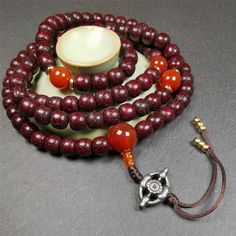 ❤This mala is made by Tibetan craftsmen and come from Hepo Town, Baiyu County,Tibet, the birthplace of the famous Tibetan handicrafts.It's composed of 108 pcs 9mm lotus seed beads,with agate spacer beads,and agate bead counters,diameter 0.35",circumference 35".❤Details:Mala'perimeter is 88cm,35 inches.108 lutus seed beads approximately 9mm / 0.35 inch.1 × agate main bead,diameter 12mm × 10mm / 0.47 × 0.4 inch.2 × agate spacer beads diameter 10mm / 0.4 inch.1 × agate guru bead,22mm × 13mm / 0.87 Handmade Spiritual Round Beads, Handmade Round Mala For Meditation, Handmade Round Spiritual Mala, Handmade Spiritual Round Mala, Traditional Mala With 108 Beads As Gift, Red Mala With 108 Beads For Puja, Spiritual Polished Beads Round Mala, 108 Beads For Gifts And Festivals, Traditional Handmade Beaded Bracelets For Meditation