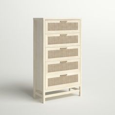 an image of a white dresser with wicker drawers