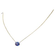 This necklace features an oval-cut Tanzanite with a weight of 3.77 carats, set in 14k yellow gold (YG). Tanzanite is a striking blue-violet gemstone known for its vivid color and allure. Oval cuts are also a popular choice for gemstones, as they offer a timeless and elegant appearance. Necklaces featuring Tanzanite can be quite eye-catching and are often chosen for their beauty and uniqueness. Tanzanite Necklace, Bleu Violet, Blue Tanzanite, Blue Violet, Tanzania, Necklace Pendant, Chains Necklace, Vivid Colors, Violet