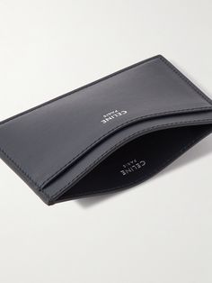 Use CELINE HOMME's sleek cardholder to keep your most-used credentials organised. Made in Italy from leather with a subtle grain, it has a single slot on each side and a central compartment for bills and receipts. A silver designer emblem is stamped on the front. Modern Business Card Holder With Card Slots, Modern Leather Card Holder For Business, Modern Leather Business Card Holder, Modern Leather Card Holder With Interior Slots, Minimalist Business Card Holder With Interior Slots, Modern Formal Card Holder With Card Slots, Minimalist Leather Card Holder For Business, Elegant Business Card Holder With Rfid Blocking, Elegant Rfid Blocking Card Holder For Business