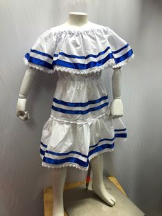 We herimos white dress with ribbons in king blue, the material is paper iba 50% cotton 50% polyester Vestido del Salvador, vestido de Nicaragua, vestido de Honduras, El Salvador dress, honduras dress, Nicaragua dress, fiesta salvadoreña White Mini Dress For Costume Party In Summer, White Short Sleeve Mini Dress For Costume Party, White Mini Dress With Short Sleeves For Costume Party, Blue Summer Dresses With Attached Cancan, White Ruffled Dress For Costume Party, White Summer Fiesta Dress, Honduras Dress, North Hills, Sewing Ideas