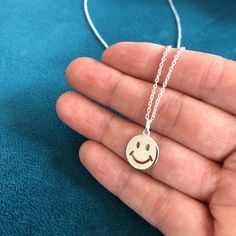 Always wear a smile! This cute Silver happy face Pendant will add a touch of fun to your style.     Smile charm measures 12mm x 12mm     18 inch silver chain Perfect for adding a quirky touch to your outfit or gifting to a friend to bring a smile to their face! Face Pendant, Jewellery Gifts, Gift For Friend, Happy Face, Gifts For Mum, Sterling Silver Pendants, Pendant Necklaces, Silver Chain, Jewelry Necklace Pendant