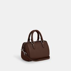 Refined pebble leather Two credit card slots Zip-top closure fabric lining Handles with 2 3/4 drop Detachable strap with 23 1/2 drop for shoulder or crossbody wear 7 (L) x 4 3/4 (H) x 4 (W) Style No. CW328 Classic Pebbled Leather Bag For On-the-go, Pebbled Leather Satchel For Daily Use In Fall, Classic Pebbled Leather Bags For Fall, Fall Pebbled Leather Satchel For Daily Use, Classic Fall Pebbled Leather Bags, Textured Leather Satchel Bag For Fall, Textured Leather Satchel For Fall, Fall Textured Leather Satchel Bag, Fall Pebbled Leather Satchel Bag