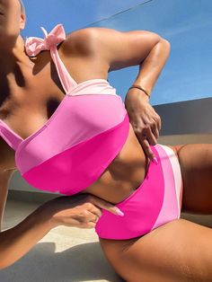 Introducing our Sarah Pink Colorblock High Waist Bikini. Show off your confidence and style this summer with our flattering and comfortable bikini. Perfect for lounging by the pool or catching some waves at the beach. Get ready to make a splash! Material: Polyester Support Type: Wire Free With Pad: Yes Pink Swimwear With Uv Protection, Pink Swimwear With Uv Protection For Pool, Pink Swimwear With Uv Protection For Swimming, Pink Uv Protection Swimwear For Pool, Pink Nylon Summer Swimwear, Pink Swimwear For Water Sports And Beach Season, Pink Nylon Tankini For Vacation, Pink Nylon Beachwear Swimwear, Pink Nylon Tankini For Poolside