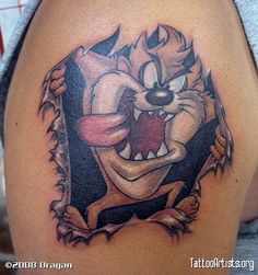 an image of a cartoon character tattoo on the back of a woman's shoulder