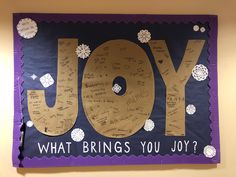 a bulletin board with the word joy written on it