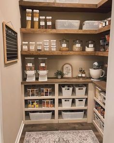 an organized pantry with baskets, food and other items on the shelve shelves