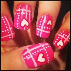 pink and white nails with hearts on them