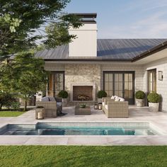 an outdoor living area with a pool and fire place