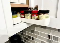 spices are stored in the spice rack on the kitchen counter