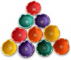 six different colored bowls with the letters set of 10 handmade diyas on them