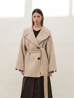 Editor's NotesRTF Camel Hair Wide Collar Half Coat is Feminine look with wide collar Handmade half coat. Loose-fit wool coat with a relaxed mood. This coat is a product that is active due to its back-centered corrugation.- It has a self-belt that can be attached to it, can create a wide outfit- a half-length lining with thickness- Highlight luxury using the Real Cow horn buttonMeasurements(in.)Size: XS, S, M- Sleeve Length From Center Back: 31.9 in. / 32.3 in. / 32.7 in.- Chest: 23.4 in. / 24.4 in. / 25.4 in.- Hem opening: 21 in. / 21.9 in. / 22.8 in.- Sleeve opening: 11.4 in. / 11.6 in. / 11.8 in.- Length: 32.3 in. / 32.7 in. / 33 in.*Model info: Height 5ft 7. / Bust: 30 in. / Waist: 24 in. / Hips: 34 in. / 'S' SIZE*Model info: Height 5ft 5. / Bust: 28.5 in. / Waist: 23 in. / Hips: 34 in. Half Coat Outfits For Women, Wide Outfit, Coat Outfits For Women, Cow Horns, Coat Outfits, Signature Look, Feminine Look, Wool Coat, Horn