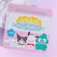 the sanrio characters sticker is attached to a keychain on a pink background