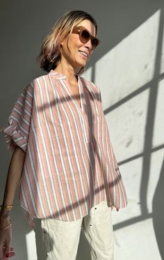 Our two pocket shirt in short sleeve in a soft pink strip. A perfect summer shirt with a cool oversized look. We love it with sleeves rolled up. Tuck it in for more shape and leave it out for a boxy minimal look. Perfect to wear year round.  This Fabric gets softer with every wash. Color:  Rose Stripe —  100% handwoven Short Sleeve Shirt Outfit, Minimal Fashion Summer, Summer Shirt Dress, Cotton Short Tops, Tunic Designs, Shirt Dress Summer, Minimal Look, Striped Short Sleeve Shirt, Hand Woven Textiles