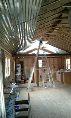 the inside of a house being built with metal roofing