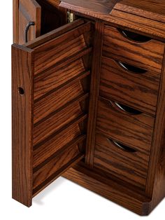 a close up of a wooden cabinet with drawers on the bottom and one drawer open