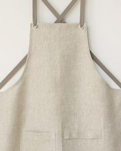 an apron hanging up against a wall