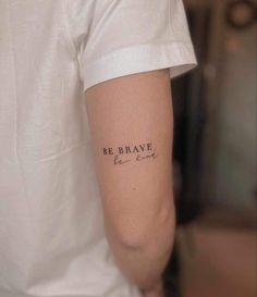 a person with a tattoo on their arm that reads be brave and the words are written in cursive font