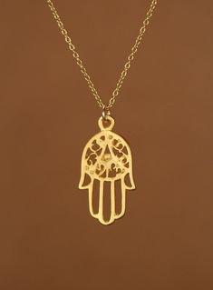 Gold hamsa necklace - hamsa necklace - protection - amulet - a filigree style gold overlay hamsa charm on a 14k gold vermeil chain This dainty and beautiful gold vermeil hamsa hangs from an 18 inch 14k gold vermeil chain. Please feel free to select a different length chain if you prefer. This hamsa measures 18mmx12mm. The Hand (Khamsa), particularly the open right hand, is a sign of protection that also represents blessings, power, and strength, and is seen as potent in deflecting the evil eye. Traditional Handmade Gold Charm Necklaces, Gold Amulet Charm Necklace, Handmade Gold Star Of David Necklace, Gold Hammered Amulet Necklace, Gold Hand-strung Amulet Necklace, Gold Tarnish-resistant Amulet Charm Necklace, Gold Star Of David Amulet Necklace, Hamsa Necklace Gold, Opal Hamsa Necklace