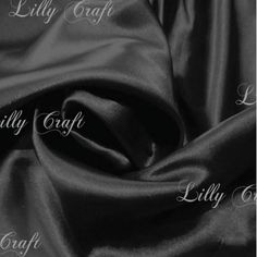 black satin fabric with the words lily craft on it