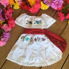 Beautiful Mexican dresses off the shoulders ! SHOES NOT INCLUDED- sold separately. Hand embroidered Mexican girls dresses !! I will include a Mexican sash that match the color of the dress and the embroidery. EVERY SINGLE DRESS IS UNIQUE - each one has unique embroidery.. I will choose at random when shipping accordingly the color fabric dress you choose. Each dress has elastic band on shoulder and waist very stretchy. I recommend order accordingly your child actual age., if you order size large White Summer Fiesta Dress, Cute White Dress With Embroidered Hem, Cute Embroidered White Dresses, Cute White Embroidered Dresses, White Spring Fiesta Dress, White Dress For Spring Fiesta, Single Dress, Unique Embroidery, Mexican Girl