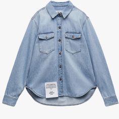 Nwt. Zara X Good American Collection Blue Denim Shirt With Collar, Long Sleeves, And Tabs, Patch Pockets With Flaps At Chest, Round Hem, Contrasting Front Metal Button Closure. Size 7. Ref. 9863/060. Pit To Pit 29" Flat, Shoulders 121", Sleeves 25", Length 32". Jn. Light Blue Denim Tops For Fall, Fall Light Blue Denim Tops, Light Blue Denim Tops For Work, Zara Medium Wash Denim Top With Pockets, Zara Blue Denim Top For Fall, Oversized Zara Cotton Denim Jacket, Zara Denim Tops With Pockets, Zara Oversized Cotton Denim Jacket, Zara Dark Wash Casual Denim Top