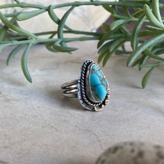 This handmade ring is made of sterling silver and Cripple Creek turquoise.  The versatile Southwestern style is both casual and elegant.  Inner diameter is 18mm (size 7 3/4). Handmade Western Turquoise Ring In Sterling Silver, Southwestern Turquoise Teardrop Ring, Western Style Turquoise Sterling Silver Ring, Rustic Sterling Silver Turquoise Ring Gift, Western Sterling Silver Gemstone Ring, Western Style Sterling Silver Gemstone Ring, Bohemian Sterling Silver Turquoise Teardrop Ring, Southwestern Turquoise Ring In Sterling Silver, Southwestern Style Turquoise Gemstone Ring In Sterling Silver