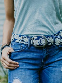 This belt is truly a work of wearable art, produced over many hours with intricate hand embroidery. Deep rich blue is accented with an energetic floral pattern in creamy ivory.Fits most standard belt loops so you can wear with your favorite jeans, or try layering it over a sweater dress to change up the look! 100% wool Boho Style Accessories, Indigenous Women, Embroidered Belt, Stacked Earrings, Precious Gemstones Jewelry, Simple Leather, Indian Fabric, Hand Tooled Leather, Ethical Clothing