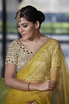 This crowd pleasing mustard net saree with mirror work highlight and scallop border detailing is paired with with our mirror and pearl work blouse. Designer Sheer Dupatta Blouse For Diwali, Festive Yellow Pre-draped Saree With Mirror Work, Gold Bollywood Blouse With Sheer Dupatta, Bollywood Style Gold Blouse With Sheer Dupatta, Designer Blouse With Sheer Dupatta For Navratri, Diwali Blouse With Sheer Dupatta In Chinon, Designer Sheer Dupatta Blouse For Navratri, Designer Wear Blouse With Sheer Dupatta For Navratri, Chinon Blouse With Sheer Dupatta For Diwali