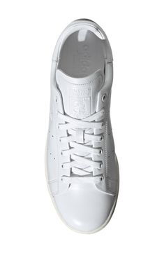 Sleek and smart, this sneaker named for tennis legend Stan Smith features premium leather inside and out plus foil-stamped details for elevated polish. Pops of color and a grippy rubber tread keep the heritage spirit alive and scoring. Lace-up style Removable insole Leather upper and lining/rubber sole Imported Tennis Legends, Dress Code, White White, Dress Codes, Up Styles, Adidas Originals, Outfit Of The Day, Rubber Sole, Men's Fashion