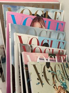 several magazines stacked on top of each other