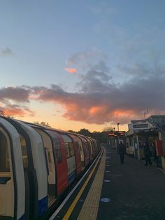 the train is stopped at the station waiting for passengers to get on or off it