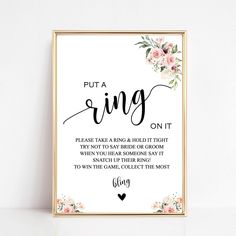 a framed print with the words put a ring on it and flowers in black ink