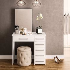 a dressing table with a mirror and stool next to it on a hard wood floor